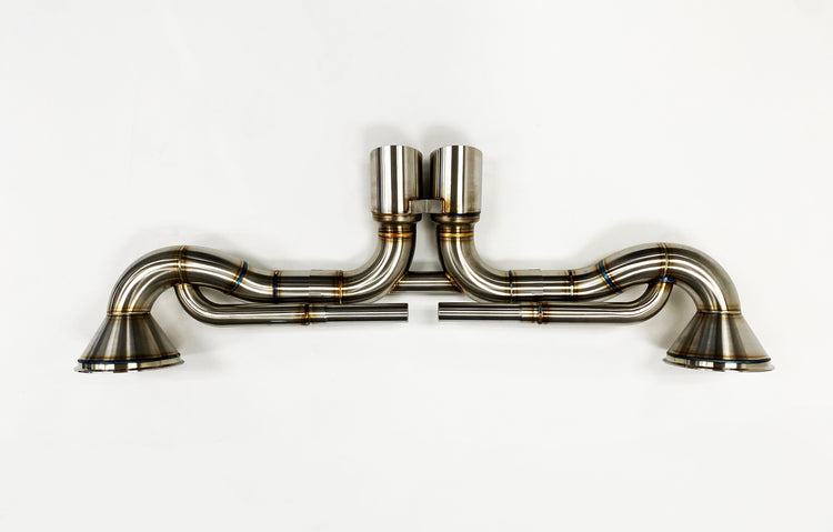 A top wide view of the Shark Werks Exhaust System for Porsche 992 GT3 / GT3RS with a white background
