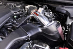 Wide shot of Stillen Hi-Flow Air Intake Kit [A35] - Dry Filter for Nissan Maxima (2009-2015) fitted inside a car