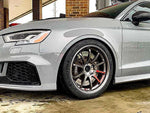 A close up view of the side of a grey car and its wheel fitted with AP Racing by Essex Radi-CAL ENP Competition Brake Kit (Front CP9660/372mm)- Audi RS 3 (8V)