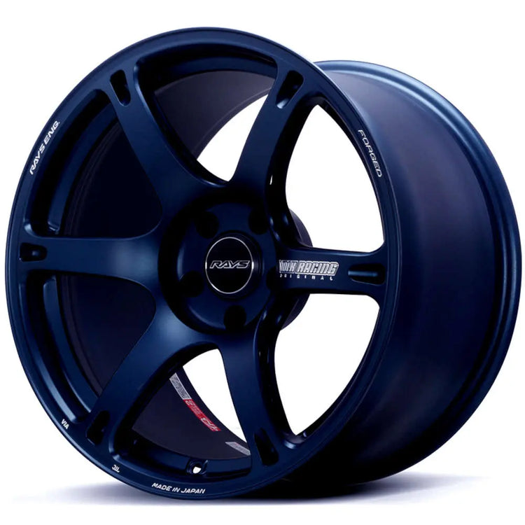 A front view of Volk Racing TE037 6061 Wheel 18x8.5 5x114.3 35mm Mag Blue with white background