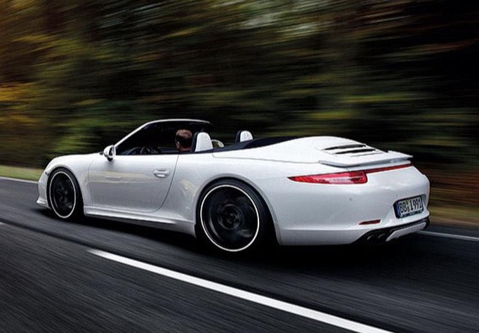 A side view of TECHART Rear Spoiler I PU-RIM Porsche 991 Carrera / Targa fitted on a running car on the road