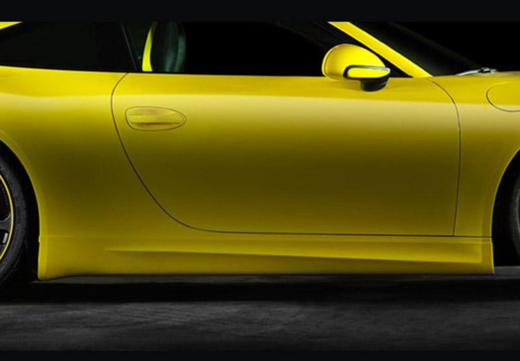 A close up view of TECHART Side Skirts Porsche 991 Carrera fitted on a yellow car