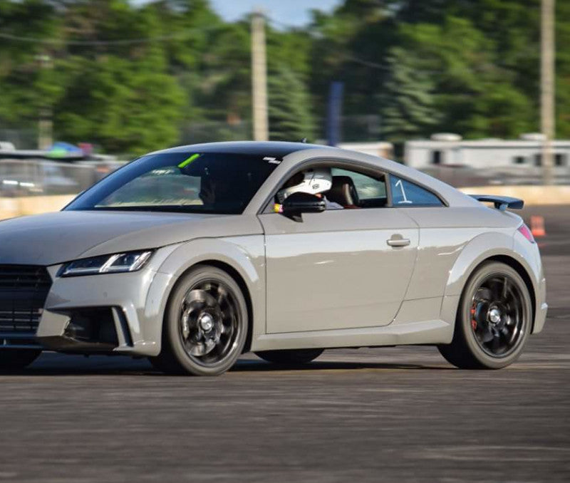 A wide view of an Audi on the road with the wheels fitted with AP Racing by Essex Radi-CAL ENP Competition Brake Kit (Front CP9660/372mm)- Audi TTRS (8S)