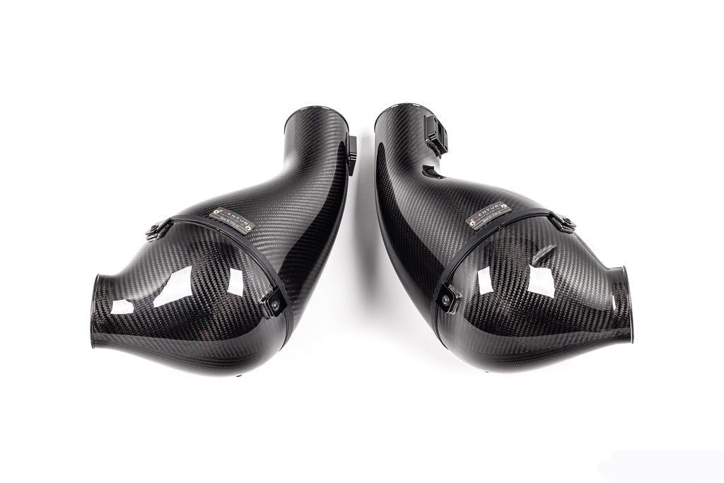 A top close up view of the filter housings of the Eventuri Black Carbon Intake System for Lamborghini Huracan EVO / STO 2019-2025 with white background