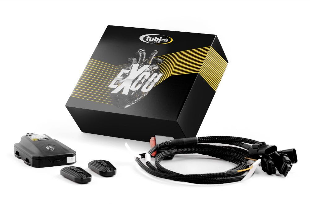 A front wide view of a box of remotes and wires of Tubi Style Muffler Kit with Valves and GPF Emulator for Ferrari 296 GTB and GTS 2021+ with white background