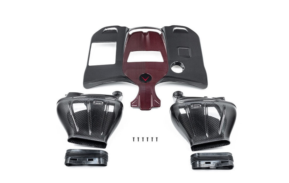 A top wide view of all the parts of the Eventuri Carbon Intake System for Mercedes G63 AMG 2019-2025 on a white background