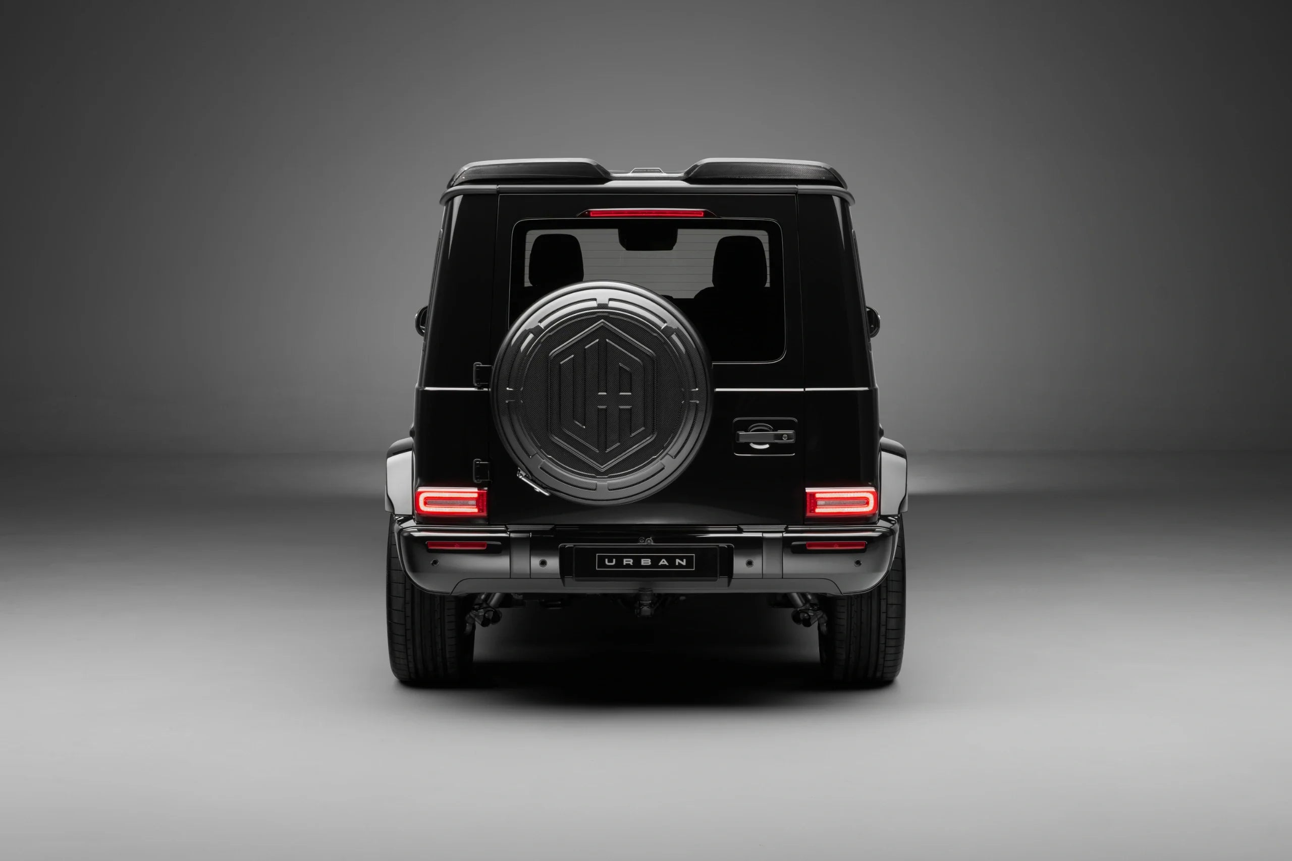 Straight-on rear view of a G63 W465 with the Urban Aero Kit spoiler and wheel carrier cover