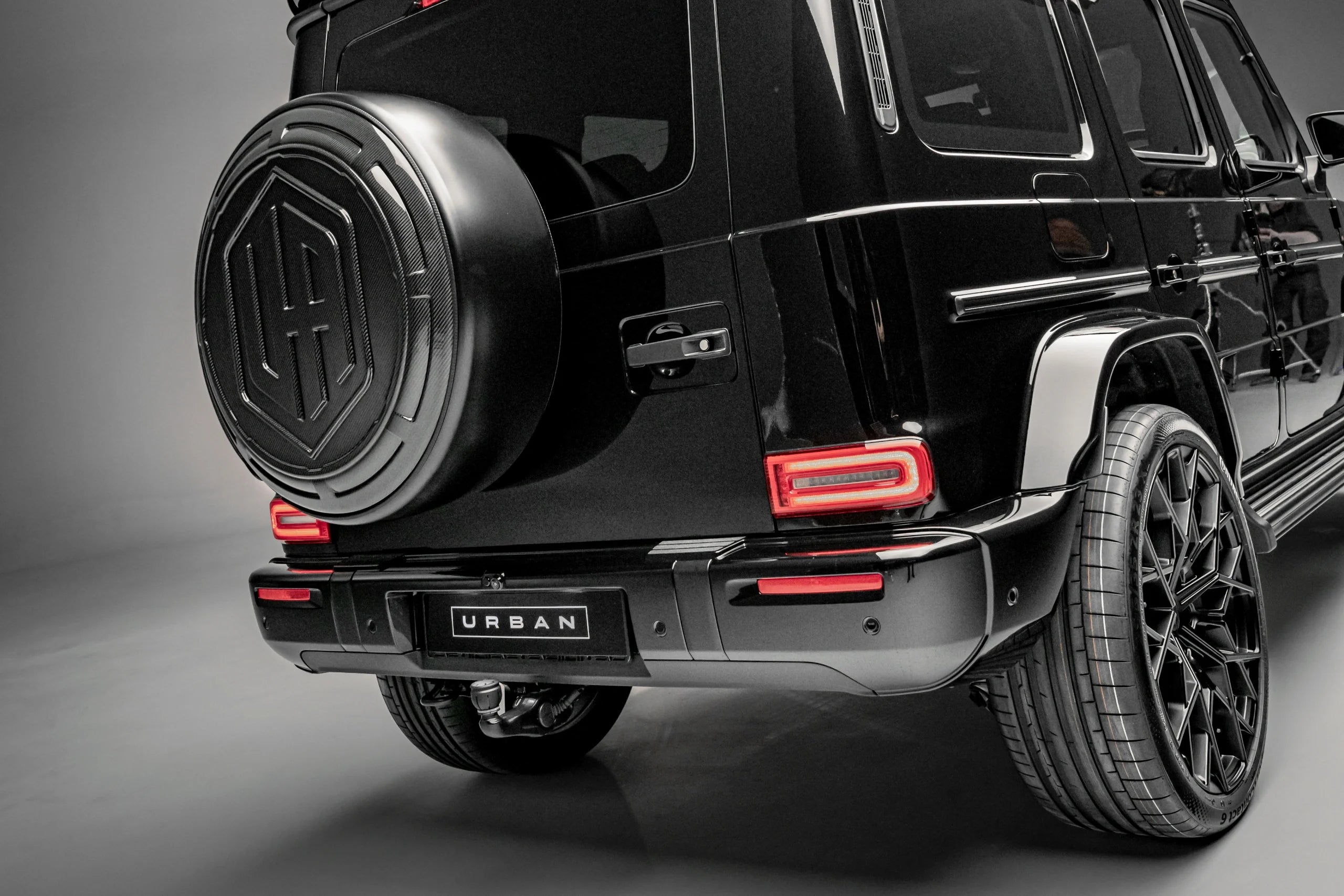 Close-up of the Urban UA Icon carbon spare wheel carrier cover on a Mercedes-AMG G63 W465