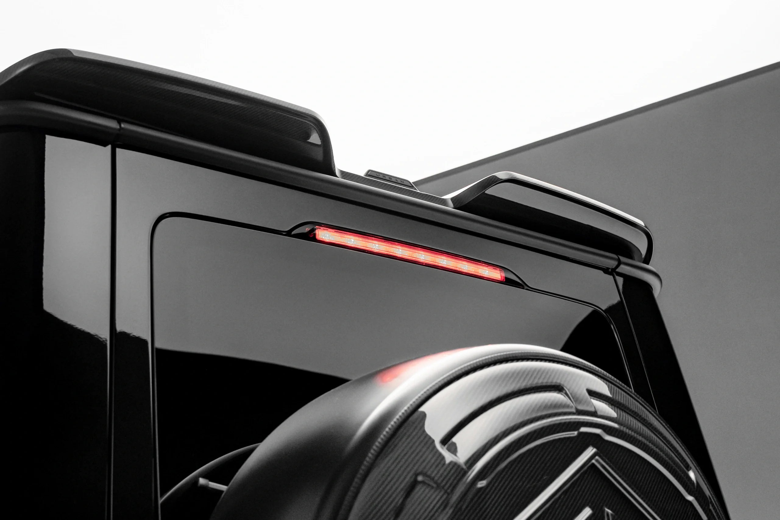 Urban visual carbon upper rear spoiler with emblem on the G63 W465 roof
