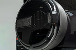 Close-up of the Urban OCTA V2 offset logo spare wheel cover with forged carbon insert