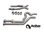 Active Autowerke F98 X4 M equal length mid pipe sections laid out with clamps