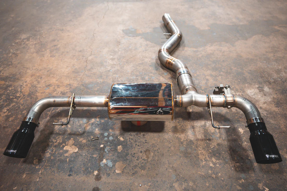A top overview of Valvetronic Designs Valved Axleback Exhaust System with Black exhaust tips on the ground (for BMW G20/G22 330i/430i). 