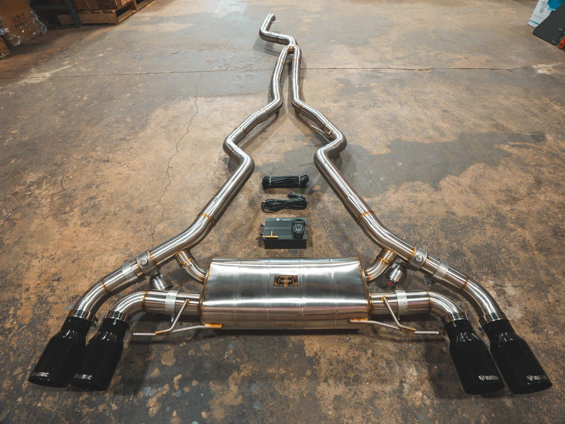 A top overview of Valvetronic Designs Valved Sport Exhaust System with Black exhaust tips on the ground (for BMW G20/G22 M340i/M440i).
