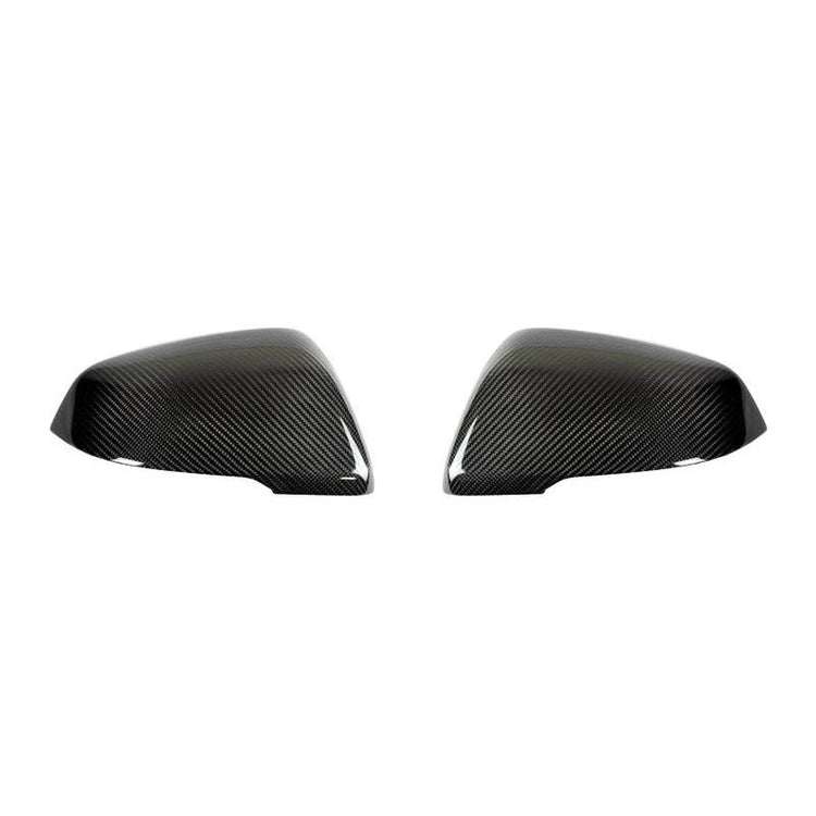 A front view of AutoTecknic Aero Replacement Carbon Fiber Mirror Covers For BMW F48 X1 2016-2020 with white background