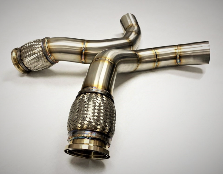 A top view of Evolution Racewerks Competition Series Catless Secondary Downpipe BMW M5/M8 S63M Engine in Brushed Finish