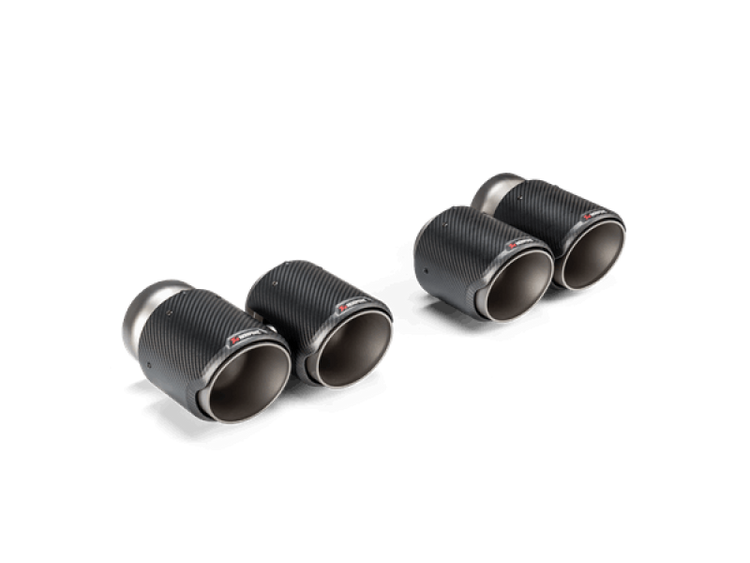 A side wide view of Akrapovic 2021+ BMW G87 M2, G80 M3, G82 M4 Tail Pipe Set (Classic Carbon Design)