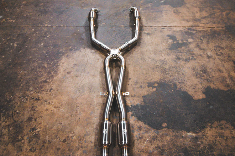 A top overview of Valvetronic Designs Midpipe V2 on the ground (for BMW M3 E9x).