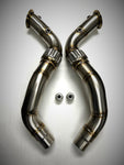 A top view of Evolution Racewerks Competition Series Catless Downpipe BMW N63 Engine with Brushed Finish